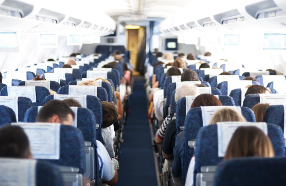 passengers on plane aisle