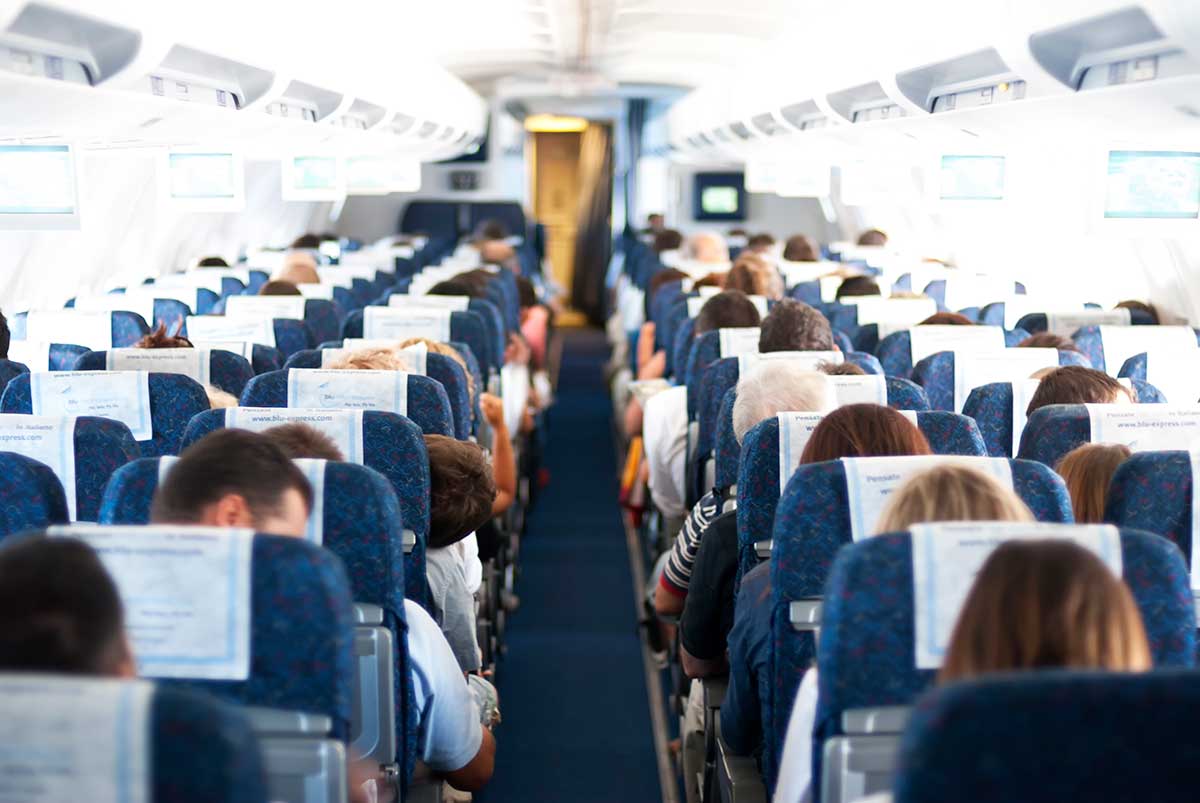 passengers on plane aisle