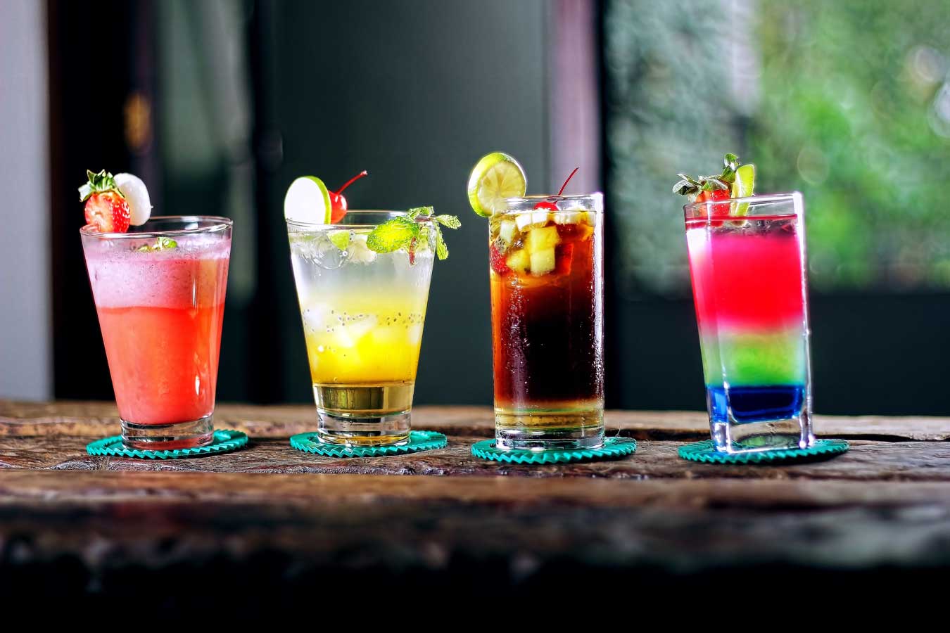 four cocktails drinks alcohol bar