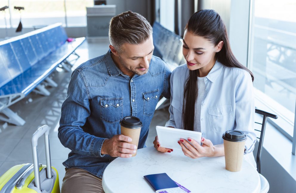 Man and woman with travel documents